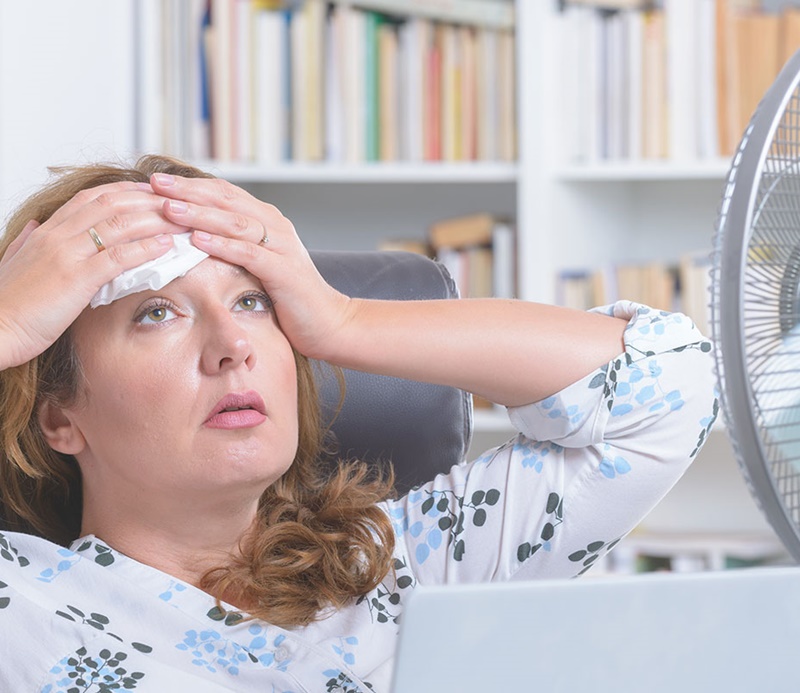 Lady in a stuffy hot office