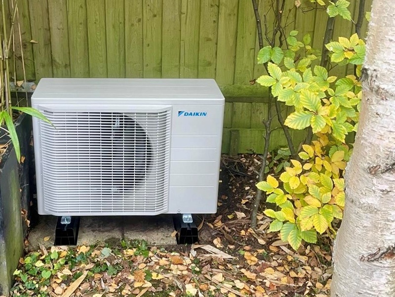 Air con condensor in garden